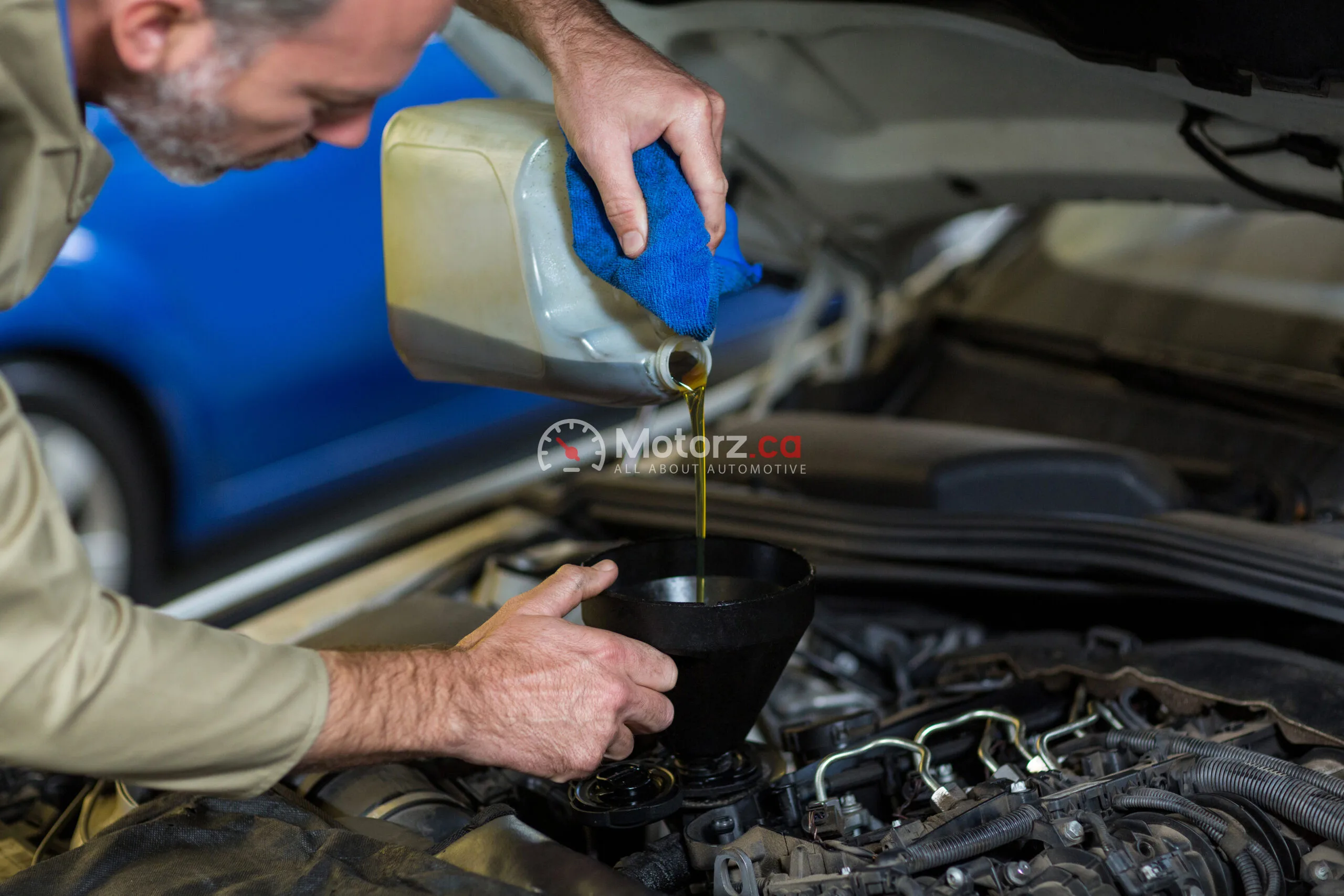 The Importance of Regular Oil Changes in Oakville 1 Mechanic pouring oil into car engine