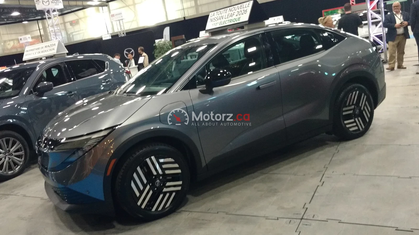 Recent Canadian vehicle recalls drivers should check in August 2026 1 Grey 2026 Nissan Leaf displayed at a Quebec auto show